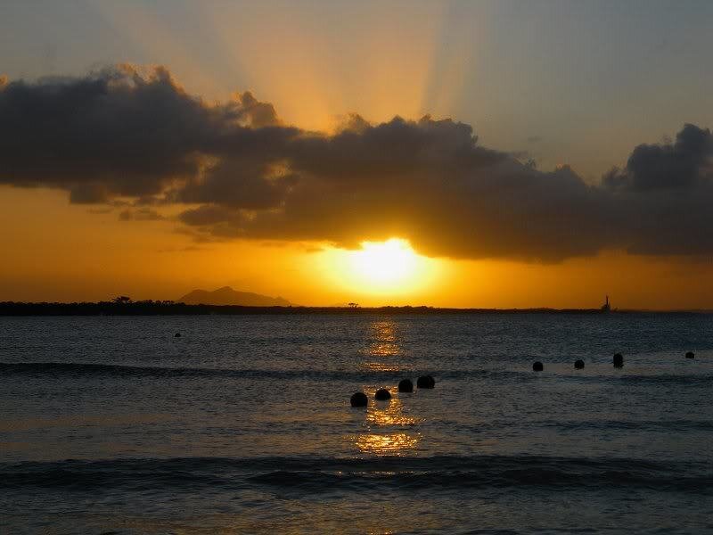 Sunset over Ocean — Orange, Dramatic, Photograph, Clouds, Buoys