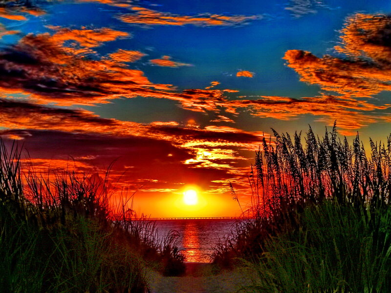 Sunset over Ocean — Orange, Dramatic, Photograph, Clouds, Grass, Bridge