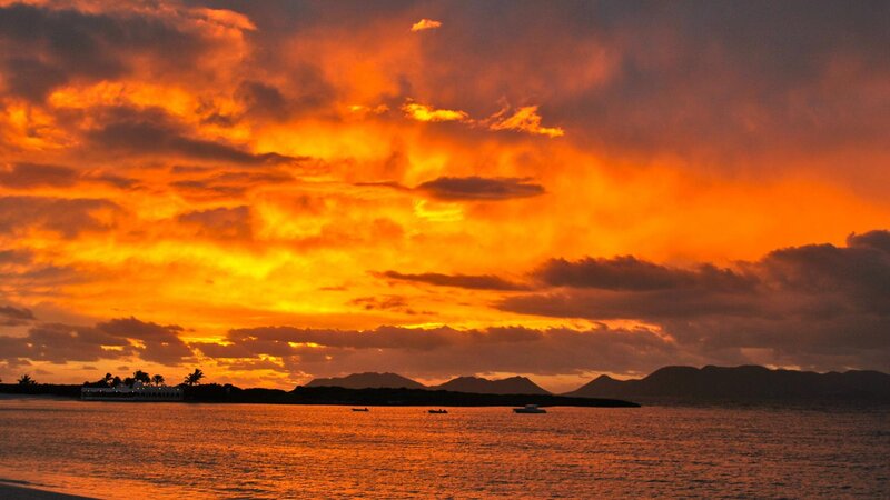 Sunset over Ocean — Orange, Dramatic, Photograph, Clouds, Mountains, Boats