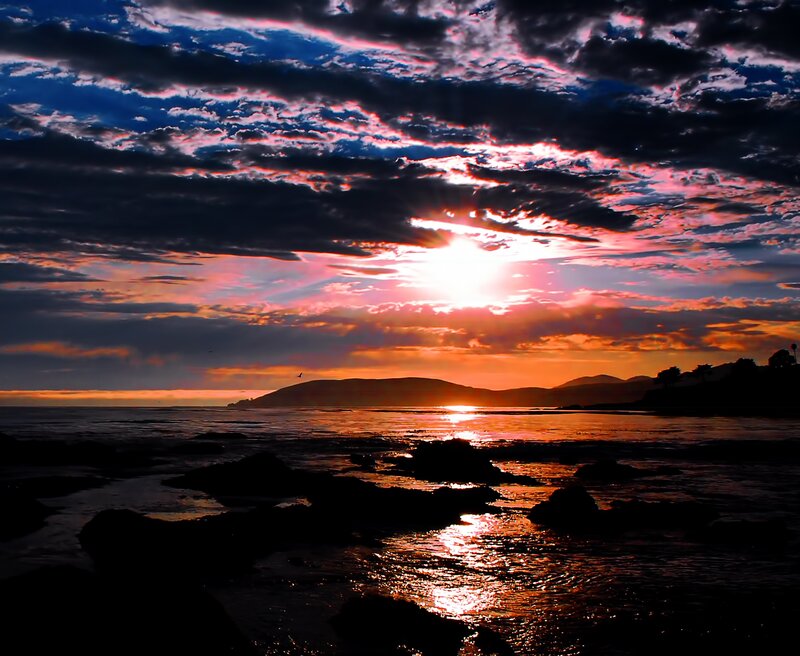 Sunset over Ocean — Orange, Dramatic, Photograph, Clouds, Mountains, Rocks