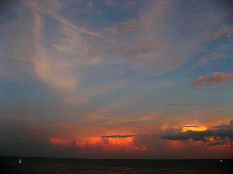 Sunset over Ocean — Orange, Dramatic, Photograph, Clouds, Sailboats