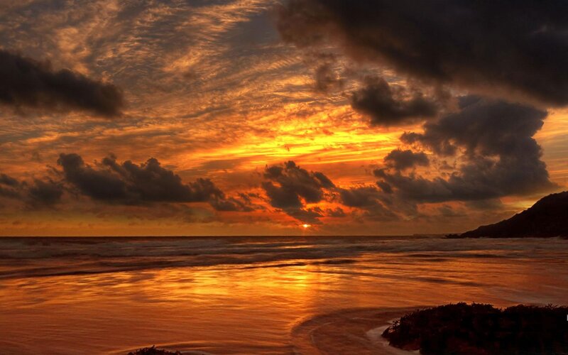 Sunset over Ocean — Orange, Dramatic, Photograph, Clouds, Sea, Mountain