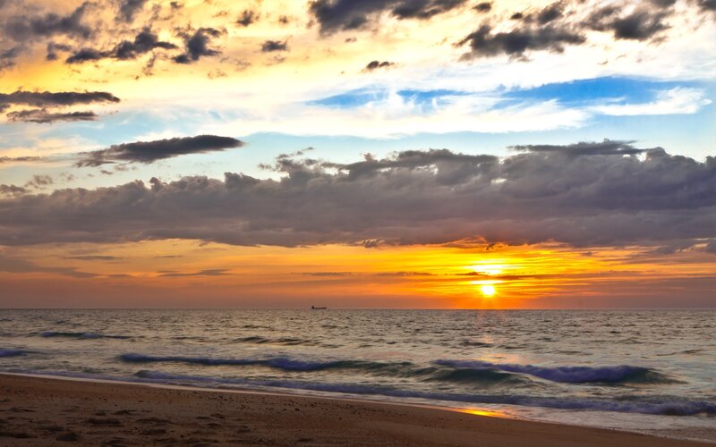 Sunset over Ocean — Orange, Dramatic, Photograph, Clouds, Ship, Beach, Blue
