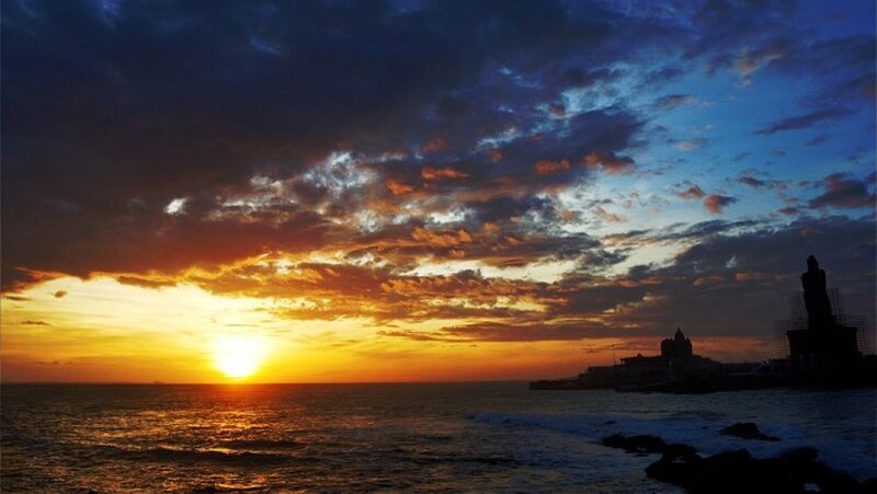 Sunset over Ocean — Orange, Dramatic, Photograph, Clouds, Statue