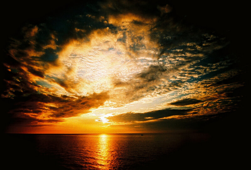 Sunset over Ocean — Orange, Dramatic, Photograph, Clouds, Sun, Boat