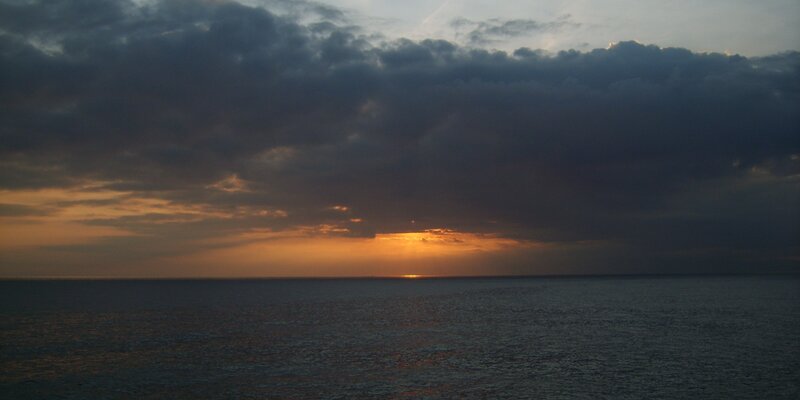 Sunset over Ocean — Orange, Dramatic, Photograph, Clouds, Sun, Horizon, Gray