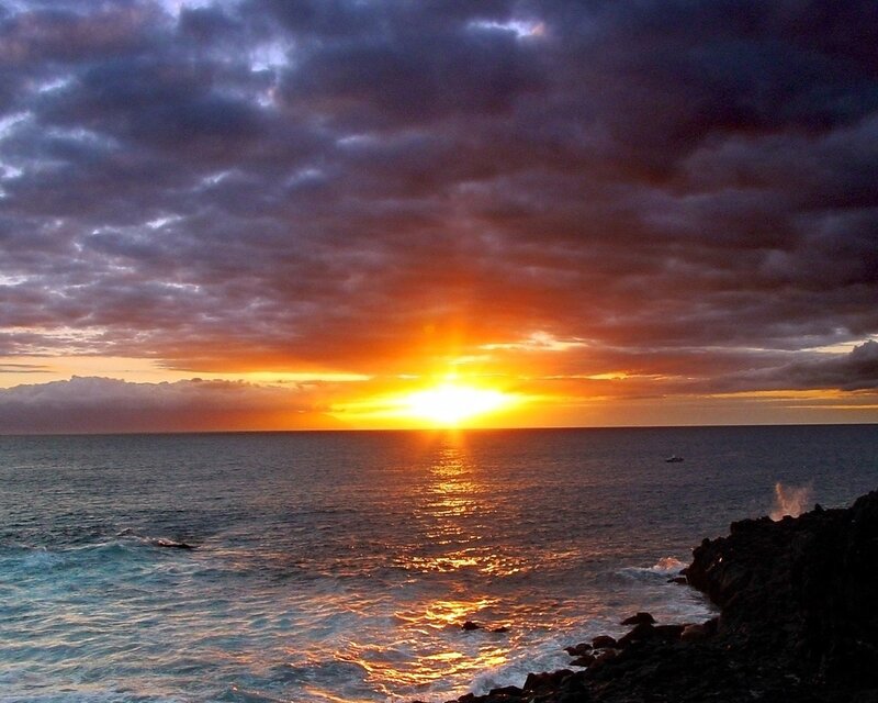 Sunset over Ocean — Orange, Dramatic, Photograph, Clouds, Sun, Rocks, Boat