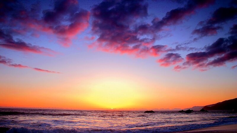 Sunset over Ocean — Orange, Dramatic, Photograph, Clouds, Waves, Mountains