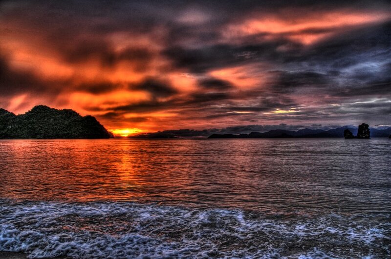 Sunset over Ocean — Orange, Dramatic, Photograph, Island, Clouds, Mountains