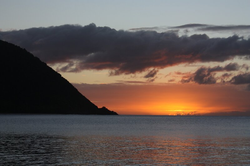 Sunset over Ocean — Orange, Dramatic, Photograph, Mountain, Clouds