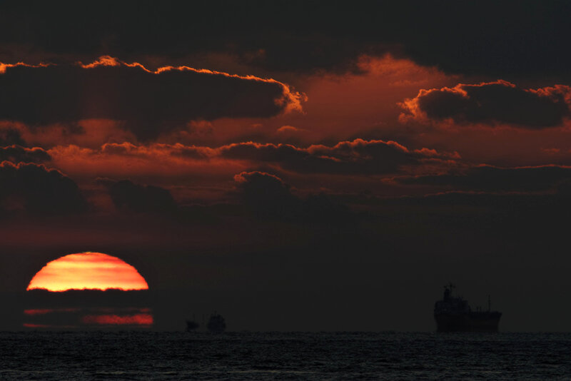 Sunset over Ocean — Orange, Dramatic, Photograph, Sun, Clouds, Ships