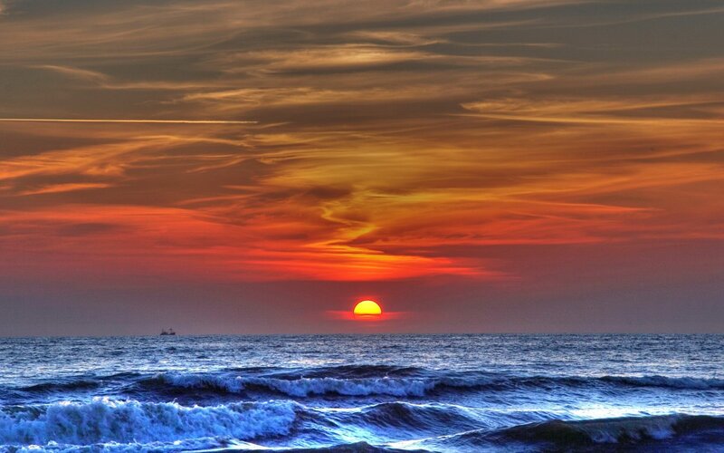 Sunset over Ocean — Orange, Dramatic, Photograph, Sun, Ship, Clouds, Red