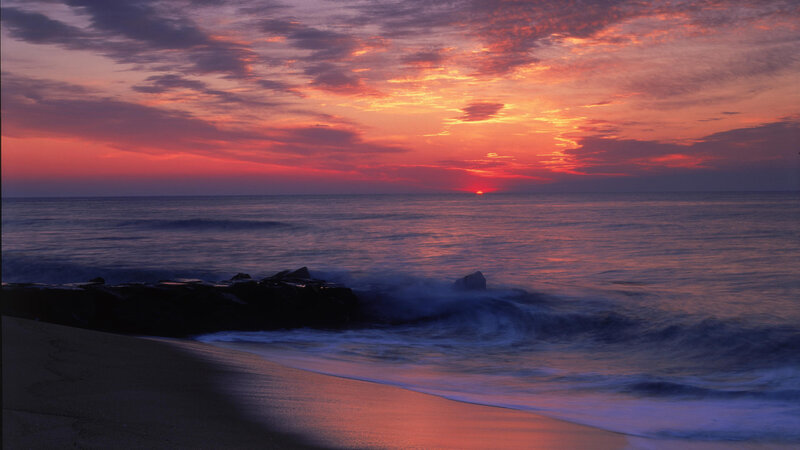 Sunset over Ocean — Orange, Serene, Photograph, Beach, Rocks, Waves
