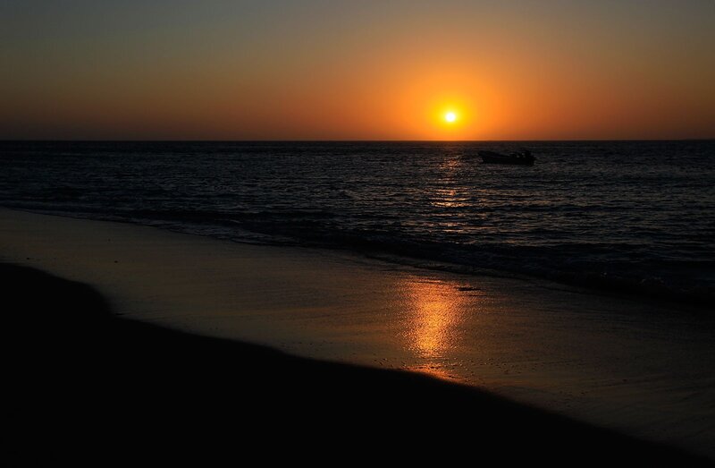 Sunset over Ocean — Orange, Serene, Photograph, Boat