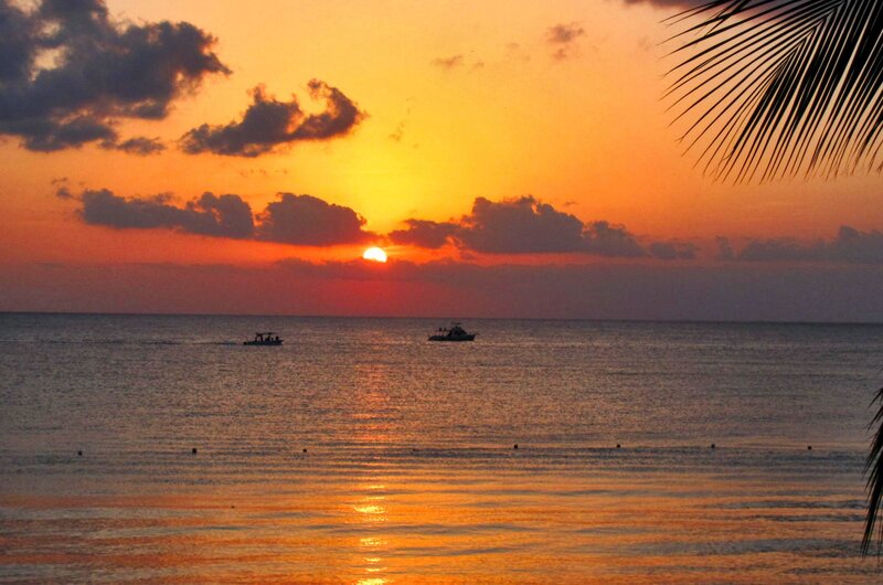 Sunset over Ocean — Orange, Serene, Photograph, Boats, Clouds