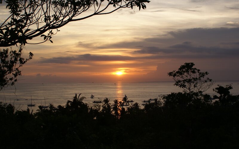 Sunset over Ocean — Orange, Serene, Photograph, Boats, Trees