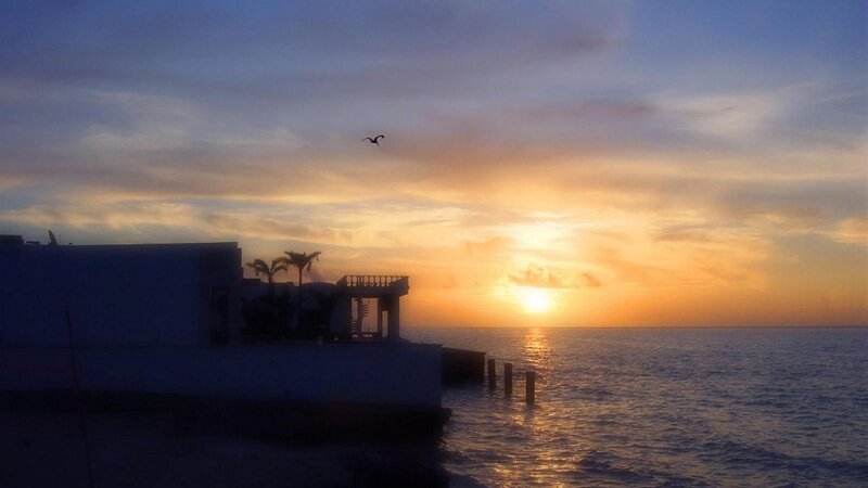 Sunset over Ocean — Orange, Serene, Photograph, Building