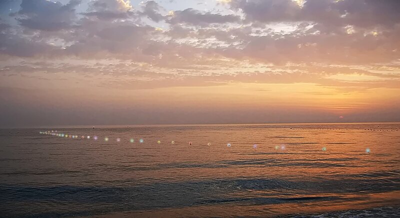 Sunset over Ocean — Orange, Serene, Photograph, Clouds, Buoys