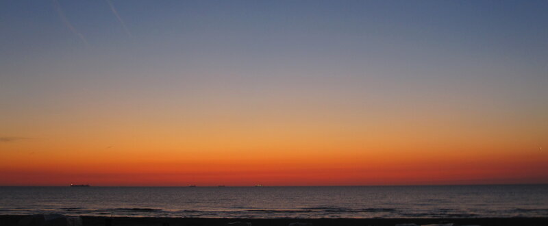 Sunset over Ocean — Orange, Serene, Photograph, Sky, Ships