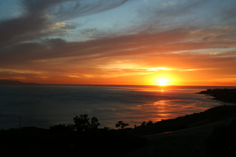 Sunset over Ocean — Orange, Serene, Photograph, Sky, Trees, Road