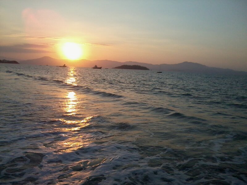 Sunset over Ocean — Orange, Serene, Photograph, Sun, Boats, Mountains