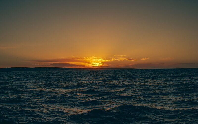 Sunset over Ocean — Orange, Serene, Photograph, Sun, Clouds, Horizon