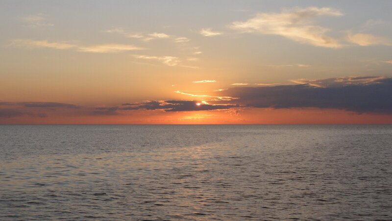 Sunset over Ocean — Orange, Serene, Photograph, Sun, Clouds, Water, Blue