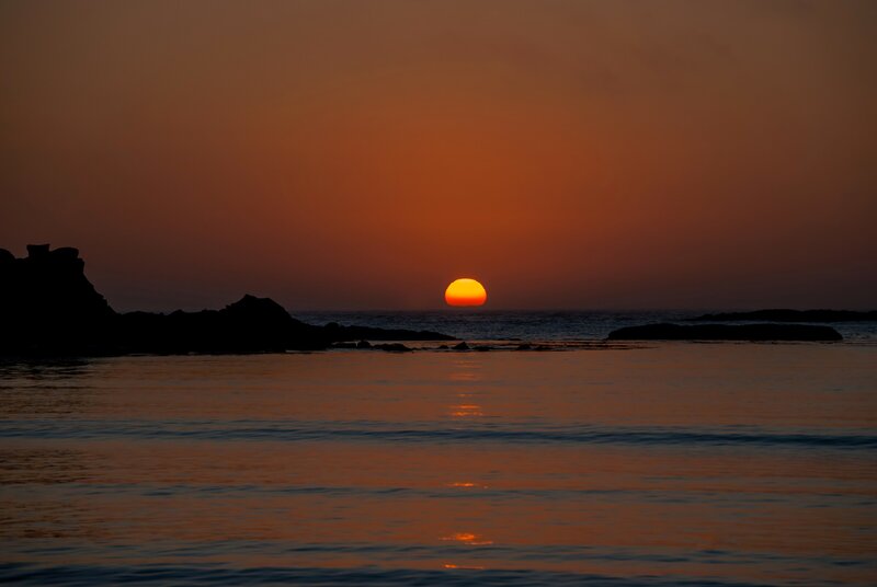 Sunset over Ocean — Orange, Serene, Photograph, Sun, Rocks, Water
