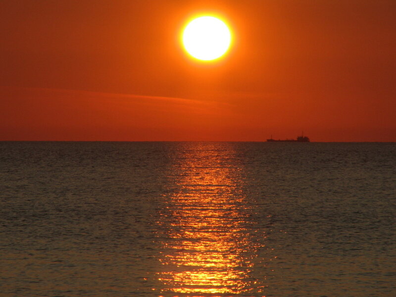 Sunset over Ocean — Orange, Serene, Photograph, Sun, Ship, Reflection