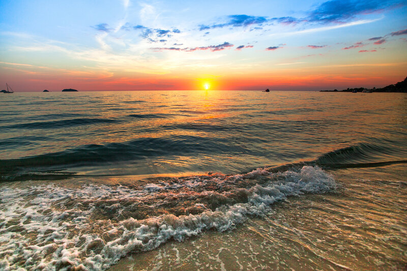 Sunset over Ocean — Orange, Serene, Photograph, Sun, Waves, Boat, Sky