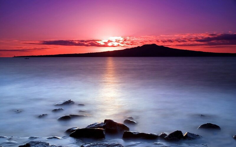 Sunset over Ocean — Purple, Serene, Photograph, Mountain, Boat, Rocks