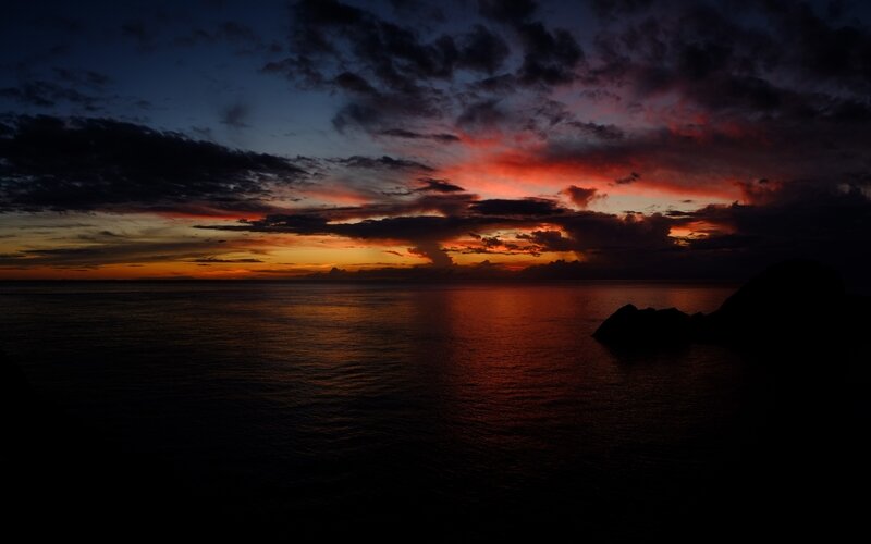Sunset over Ocean — Red, Dramatic, Photograph, Clouds, Rocks, Horizon