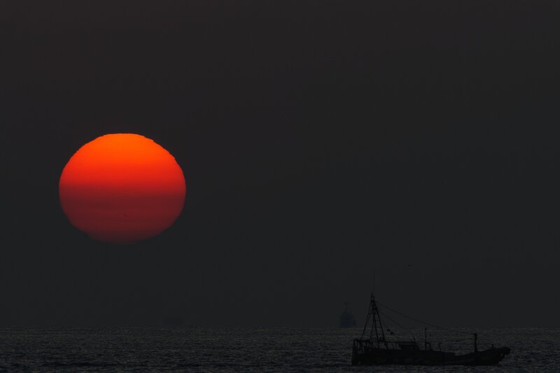 Sunset over Ocean — Red, Dramatic, Photograph, Sun, Boat, Sea