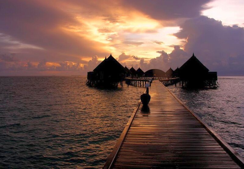 sunset over ocean villas