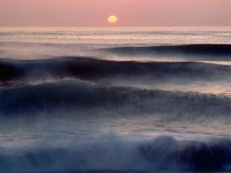 Sunset over ocean waves
