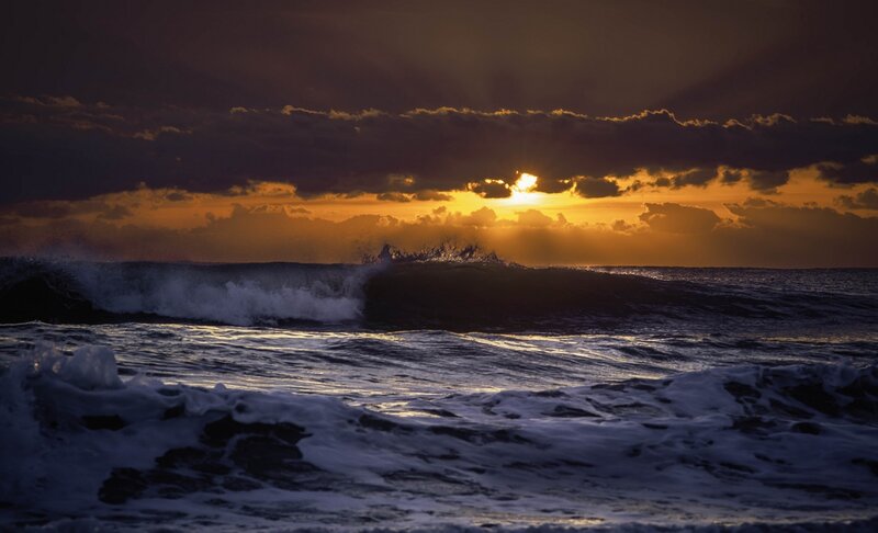 Sunset over ocean waves