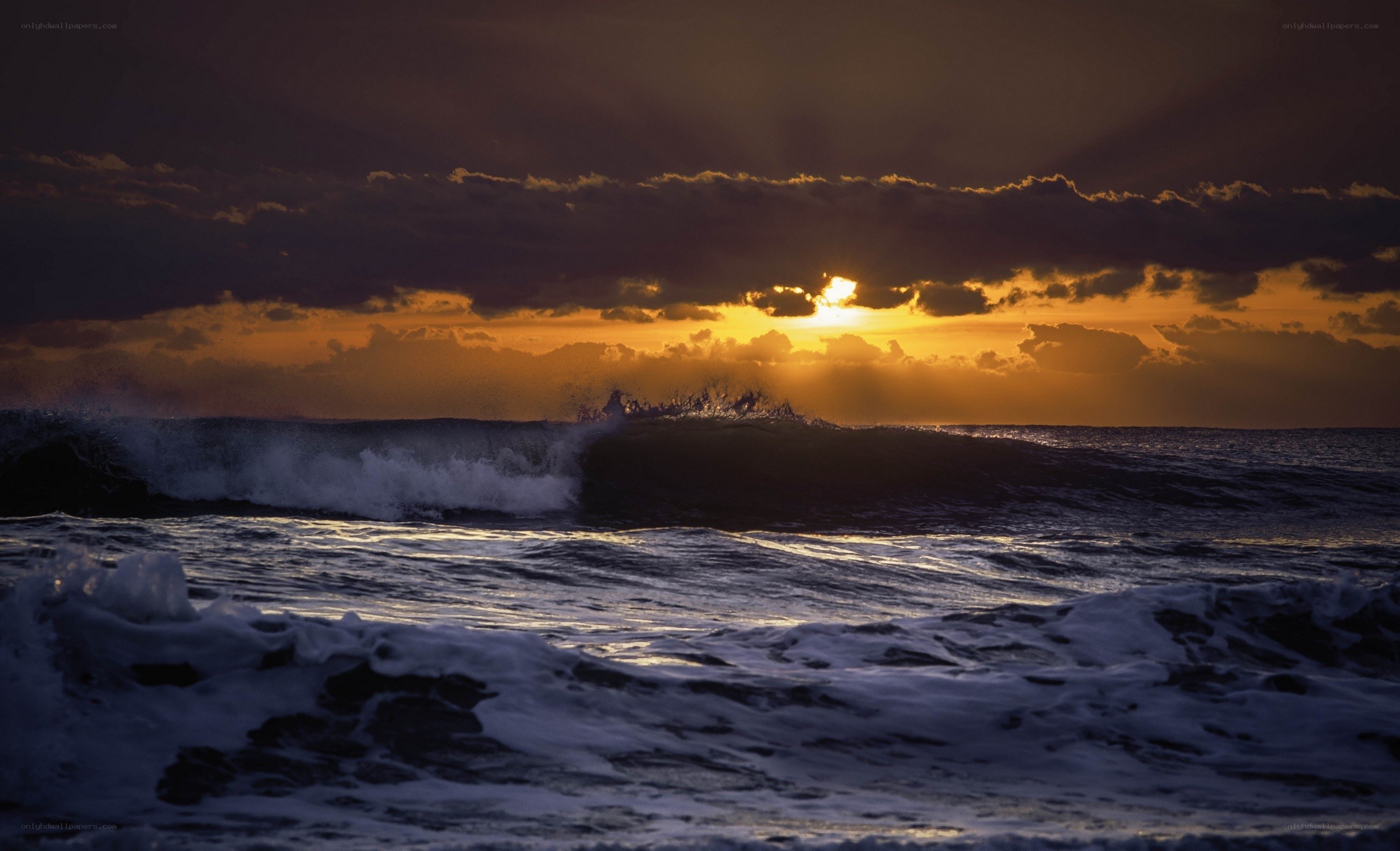 Sunset over ocean waves