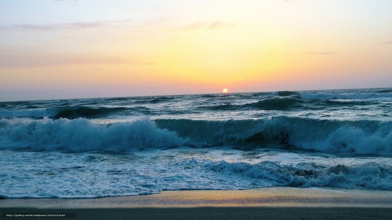 Sunset over ocean waves