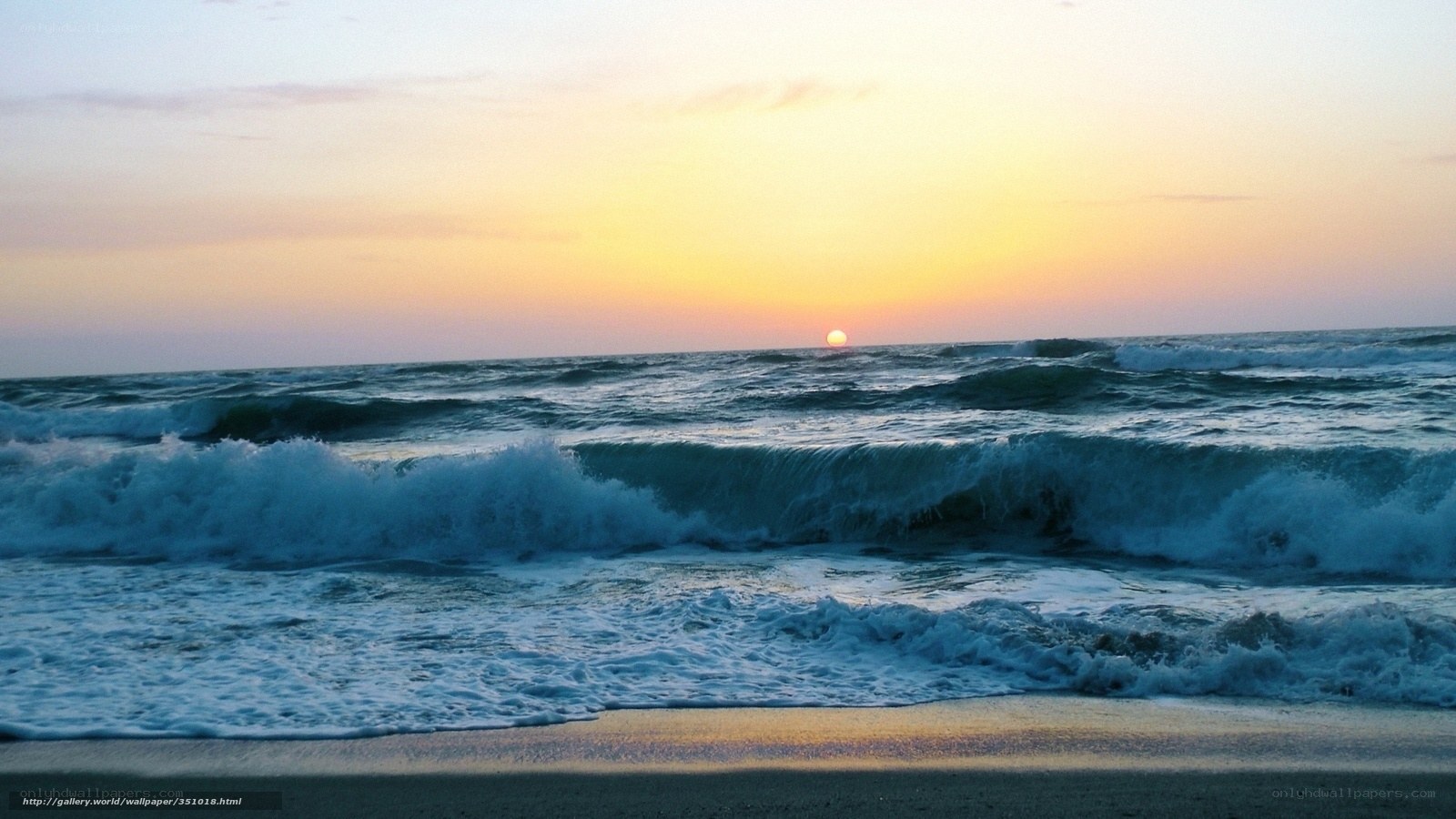 Sunset over ocean waves