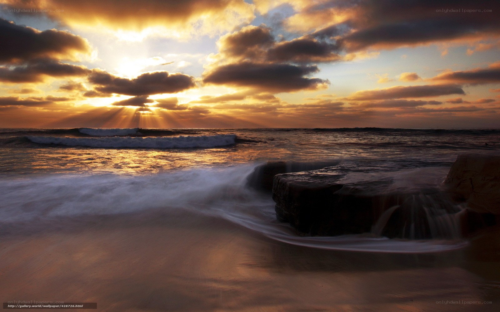 Sunset over ocean waves