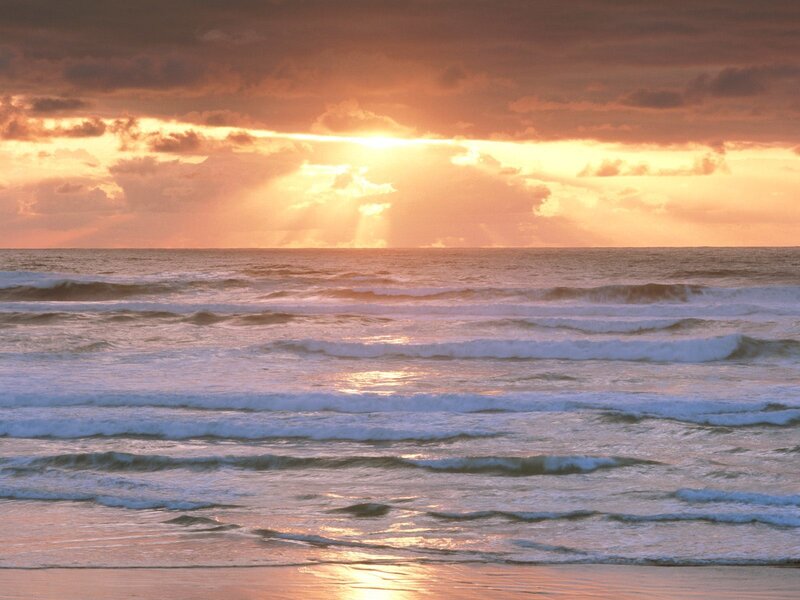 Sunset over ocean waves