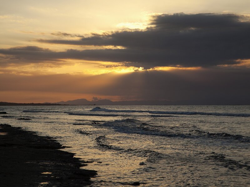 Sunset over Ocean Waves — Orange, Dramatic, Photograph, Clouds, Mountains