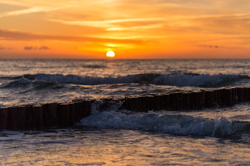 Sunset over Ocean Waves — Orange, Serene, Photograph, Breakwater