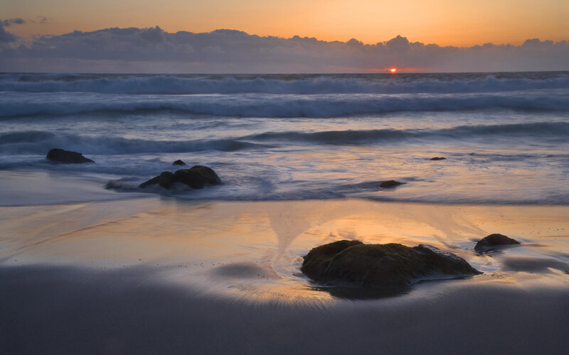 Sunset over Ocean Waves — Orange, Serene, Photograph, Rocks, Clouds