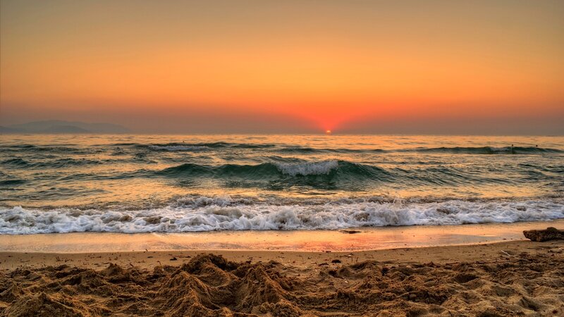 Sunset over Ocean Waves — Orange, Serene, Photograph, Sand, Mountains