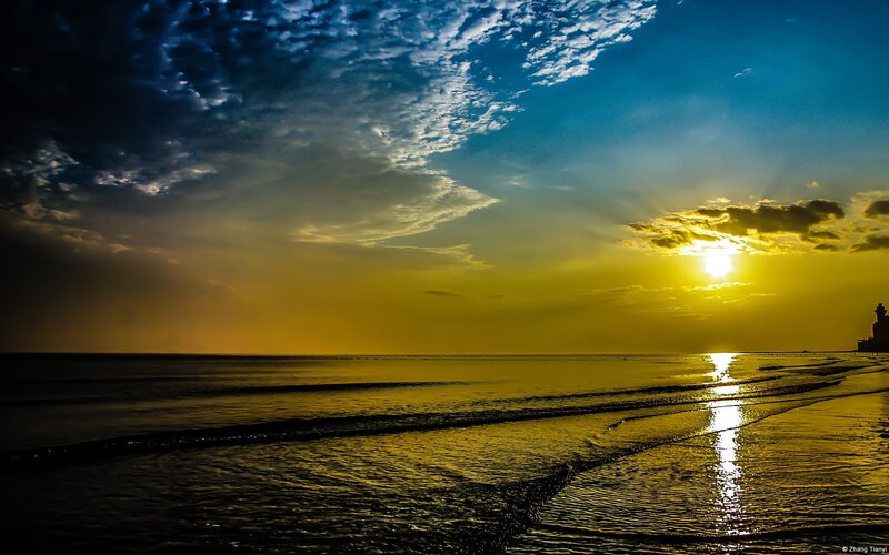 Sunset over Ocean — Yellow, Dramatic, Photograph, Clouds, Lighthouse