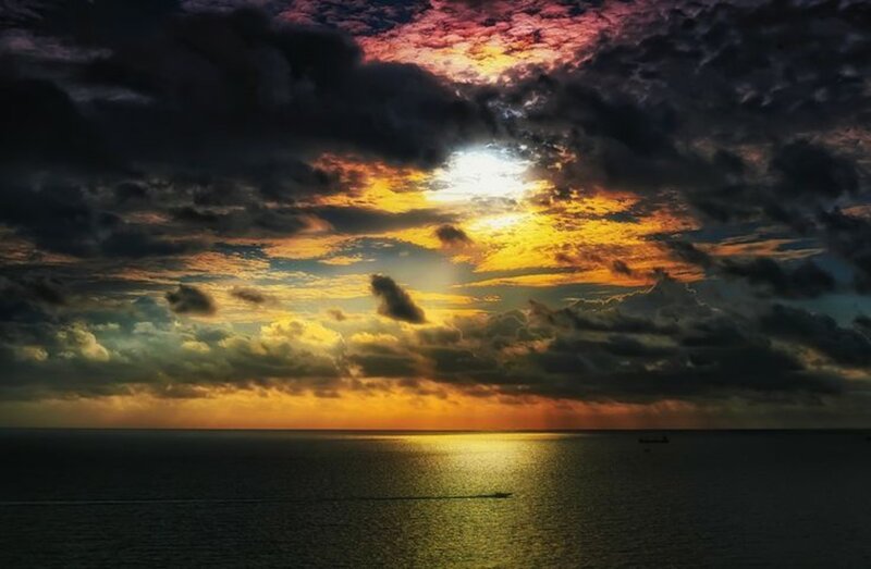 Sunset over Ocean — Yellow, Dramatic, Photograph, Clouds, Sun, Boat