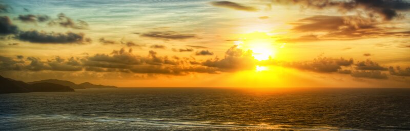 Sunset over Ocean — Yellow, Serene, Photograph, Clouds, Mountains
