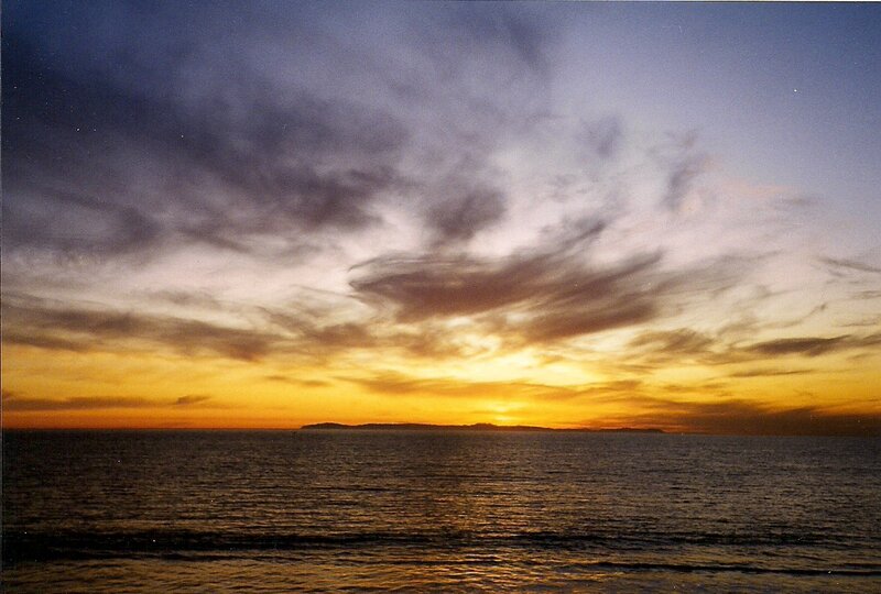 Sunset over Ocean — Yellow, Serene, Photograph, Clouds