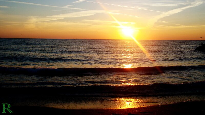 Sunset over Ocean — Yellow, Serene, Photograph, Sun, Waves